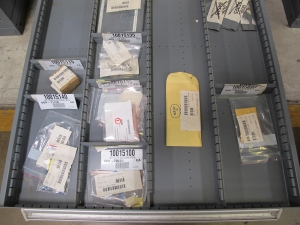 STANLEY VIDMAR CABINET, 11 DRAWER, TO INCLUDE: VOLT METERS, THERMOCOUPLE WIRE, BALLASTS, GROMMETS, ROLLERS, BLANK METERS, SUPPRESSORS. LOCATED AT W-50 . LOADING AND HANDLING FEE $25-377