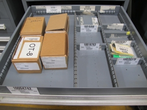 STANLEY VIDMAR CABINET, 11 DRAWER, TO INCLUDE: SPROCKETS, KNOBS, FLANGES, SYNCHROSCOPE, RESISTANCE DETECTORS, COMPRESSOR DETECTOR, SHEAVE, COVERS, POWER SUPPLIES, RESISTORS. LOCATED AT W-50 . LOADING AND HANDLING FEE $25-379