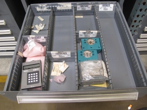 STANLEY VIDMAR CABINET, 8 DRAWER, TO INCLUDE: FLOW DETECTORS, TERMINAL BLOCKS, CAPACITORS, LUBRICATORS, CIRCUIT BREAKERS, VALVE MANIFOLDS, KEYBOARD DISPLAYS, PRESSURE REGULATOR. LOCATED AT W-50 . LOADING AND HANDLING FEE $25-381