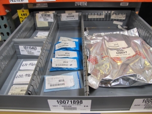 STANLEY VIDMAR CABINET, 8 DRAWER, TO INCLUDE: RIVETS, ELECTRICAL SOCKETS, CAPS, PHOTOELECTRIC CELLS, CAPACITORS, WORM AND SPUR GEARS, POWER SUPPLY, OILERS. LOCATED AT W-50 . LOADING AND HANDLING FEE $25-382