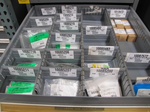 STANLEY VIDMAR CABINET, 8 DRAWER, TO INCLUDE: RIVETS, ELECTRICAL SOCKETS, CAPS, PHOTOELECTRIC CELLS, CAPACITORS, WORM AND SPUR GEARS, POWER SUPPLY, OILERS. LOCATED AT W-50 . LOADING AND HANDLING FEE $25-382