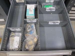 STANLEY VIDMAR CABINET, 8 DRAWER, TO INCLUDE: SCREEN FILTERS, METERING TUBES, TERMINAL WIRES, RELAYS, PRESSURE GAUGE, BRASS SHAFTS, ROTAMETERS, PINS, RINGS. LOCATED AT W-50 . LOADING AND HANDLING FEE $25-383