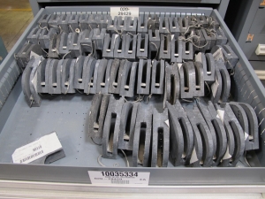 STANLEY VIDMAR CABINET, 5 DRAWER, TO INCLUDE: ELBOWS, ANCHORS, PINION GEARS, ARC CHUTES, ELECTRONIC BALANCES, STRAINERS. LOCATED AT W-50 . LOADING AND HANDLING FEE $25-386