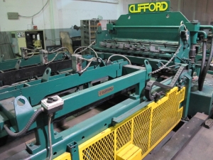 1999 CLIFFORD AUTOMATIC CNC MESH WELDING LINE, MODEL CLW12, 8MM-3MM LINE WIRE DIAMETER, 20 WIRE LINES, CROSSWIRE DIAMETER: 6MM, CROSSWIRE LENGTH: 1300 MM, LINEWIRE PITCH: INFINITELY VARIABLE FROM 10MM, CROSSWIRE FEED: SINGLE GAP TYPE MAGAZINE TOOLED FOR PRODUCING 2 MATS, SIDE BY SIDE, (10) WELDPRESSES, (20) BOTTOM ELECTRODES, (4) 125 KVA WELDING TRANSFORMERS, 120 CROSSWIRES MAX. SPEED, LINEAR MODEL QM12/25 PAILOUT, AUTOMATIC SHEET STACKER, WATER COOLING SYSTEM, MITSUISHI A1 CNC CONTROL, S/N 8874, SHEET STACKER, S/N 8979, (2) ENCLOSED CARTS FULL OF WELDING TIPS AND REALTED TOOLING INCLUDED WITH MACHINE-2
