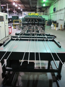1999 CLIFFORD AUTOMATIC CNC MESH WELDING LINE, MODEL CLW12, 8MM-3MM LINE WIRE DIAMETER, 20 WIRE LINES, CROSSWIRE DIAMETER: 6MM, CROSSWIRE LENGTH: 1300 MM, LINEWIRE PITCH: INFINITELY VARIABLE FROM 10MM, CROSSWIRE FEED: SINGLE GAP TYPE MAGAZINE TOOLED FOR PRODUCING 2 MATS, SIDE BY SIDE, (10) WELDPRESSES, (20) BOTTOM ELECTRODES, (4) 125 KVA WELDING TRANSFORMERS, 120 CROSSWIRES MAX. SPEED, LINEAR MODEL QM12/25 PAILOUT, AUTOMATIC SHEET STACKER, WATER COOLING SYSTEM, MITSUISHI A1 CNC CONTROL, S/N 8874, SHEET STACKER, S/N 8979, (2) ENCLOSED CARTS FULL OF WELDING TIPS AND REALTED TOOLING INCLUDED WITH MACHINE-2