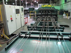 1999 CLIFFORD AUTOMATIC CNC MESH WELDING LINE, MODEL CLW12, 8MM-3MM LINE WIRE DIAMETER, 20 WIRE LINES, CROSSWIRE DIAMETER: 6MM, CROSSWIRE LENGTH: 1300 MM, LINEWIRE PITCH: INFINITELY VARIABLE FROM 10MM, CROSSWIRE FEED: SINGLE GAP TYPE MAGAZINE TOOLED FOR PRODUCING 2 MATS, SIDE BY SIDE, (10) WELDPRESSES, (20) BOTTOM ELECTRODES, (4) 125 KVA WELDING TRANSFORMERS, 120 CROSSWIRES MAX. SPEED, LINEAR MODEL QM12/25 PAILOUT, AUTOMATIC SHEET STACKER, WATER COOLING SYSTEM, MITSUISHI A1 CNC CONTROL, S/N 8874, SHEET STACKER, S/N 8979, (2) ENCLOSED CARTS FULL OF WELDING TIPS AND REALTED TOOLING INCLUDED WITH MACHINE-2