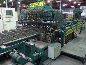 1999 CLIFFORD AUTOMATIC CNC MESH WELDING LINE, MODEL CLW12, 8MM-3MM LINE WIRE DIAMETER, 20 WIRE LINES, CROSSWIRE DIAMETER: 6MM, CROSSWIRE LENGTH: 1300 MM, LINEWIRE PITCH: INFINITELY VARIABLE FROM 10MM, CROSSWIRE FEED: SINGLE GAP TYPE MAGAZINE TOOLED FOR PRODUCING 2 MATS, SIDE BY SIDE, (10) WELDPRESSES, (20) BOTTOM ELECTRODES, (4) 125 KVA WELDING TRANSFORMERS, 120 CROSSWIRES MAX. SPEED, LINEAR MODEL QM12/25 PAILOUT, AUTOMATIC SHEET STACKER, WATER COOLING SYSTEM, MITSUISHI A1 CNC CONTROL, S/N 8874, SHEET STACKER, S/N 8979, (2) ENCLOSED CARTS FULL OF WELDING TIPS AND REALTED TOOLING INCLUDED WITH MACHINE-2