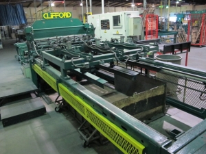 1999 CLIFFORD AUTOMATIC CNC MESH WELDING LINE, MODEL CLW12, 8MM-3MM LINE WIRE DIAMETER, 20 WIRE LINES, CROSSWIRE DIAMETER: 6MM, CROSSWIRE LENGTH: 1300 MM, LINEWIRE PITCH: INFINITELY VARIABLE FROM 10MM, CROSSWIRE FEED: SINGLE GAP TYPE MAGAZINE TOOLED FOR PRODUCING 2 MATS, SIDE BY SIDE, (10) WELDPRESSES, (20) BOTTOM ELECTRODES, (4) 125 KVA WELDING TRANSFORMERS, 120 CROSSWIRES MAX. SPEED, LINEAR MODEL QM12/25 PAILOUT, AUTOMATIC SHEET STACKER, WATER COOLING SYSTEM, MITSUISHI A1 CNC CONTROL, S/N 8874, SHEET STACKER, S/N 8979, (2) ENCLOSED CARTS FULL OF WELDING TIPS AND REALTED TOOLING INCLUDED WITH MACHINE-2