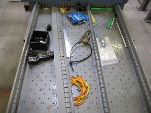 LISTA INDUSTRIAL WORK DESK, BUTCHER BLOCK TABLE TOP 60"L X 30"W, 5 DRAWER CABINET WITH CONTENTS TO INCLUDE: MISC. WIRES, TAPE, PRECISION SCREWDRIVERS. LOADING & HANDLING $15-1686
