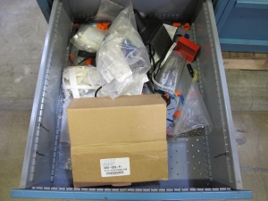 LOT TO INCLUDE: BUTCHER BLOCK TABLE TOP 72"L X 30"W, (2) LISTA 4 DRAWER CABINETS WITH CONTENTS TO INCLUDE: MISC. ELECTRIC CONNECTORS, ELECTRIC TESTING EQUIPMENT, OFFICE SUPPLIES. LOADING & HANDLING $15-1689