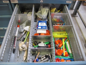 LOT TO INCLUDE: BUTCHER BLOCK TABLE TOP 72"L X 30"W, (2) LISTA 4 DRAWER CABINETS WITH CONTENTS TO INCLUDE: MISC. ELECTRIC CONNECTORS, ELECTRIC TESTING EQUIPMENT, OFFICE SUPPLIES. LOADING & HANDLING $15-1689