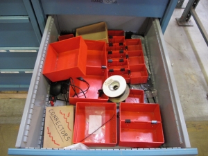 LOT TO INCLUDE: BUTCHER BLOCK TABLE TOP 72"L X 30"W, (2) LISTA 4 DRAWER CABINETS WITH CONTENTS TO INCLUDE: MISC. ELECTRIC CONNECTORS, ELECTRIC TESTING EQUIPMENT, OFFICE SUPPLIES. LOADING & HANDLING $15-1689