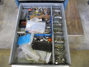 LISTA INDUSTRIAL WORK DESK, BUTCHER BLOCK TABLE TOP 60"L X 30"W, 5 DRAWER CABINET WITH CONTENTS TO INCLUDE: MISC. ELECTRICAL TAPE, ELECTRICAL TESTING WIRE AND TIPS, BRASS AND STEEL FITTINGS. LOADING & HANDLING $15-1690