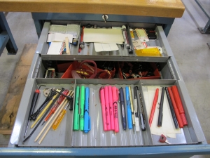 LISTA INDUSTRIAL WORK DESK, BUTCHER BLOCK TABLE TOP 48"L X 30"W, SHELF, 4 DRAWER CABINET WITH CONTENTS TO INCLUDE: MISC. OFFICE SUPPLIES, CABLES, SAFETY GLASSES, ELECTRIC TESTING WIRE. LOADING & HANDLING $15-1692