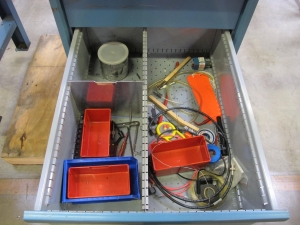 LISTA INDUSTRIAL WORK DESK, BUTCHER BLOCK TABLE TOP 48"L X 30"W, SHELF, 4 DRAWER CABINET WITH CONTENTS TO INCLUDE: MISC. OFFICE SUPPLIES, CABLES, SAFETY GLASSES, ELECTRIC TESTING WIRE. LOADING & HANDLING $15-1692