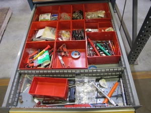 LISTA INDUSTRIAL WORK DESK, BUTCHER BLOCK TABLE TOP 60"L X 30"W, 5 DRAWER CABINET WITH CONTENTS TO INCLUDE: MISC. OFFICE SUPPLIES, TEST WIRE, EAR MUFFS. LOADING & HANDLING $15-1694