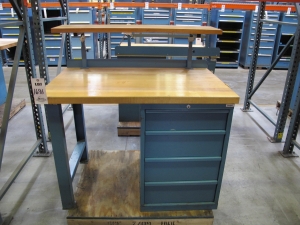 LISTA INDUSTRIAL WORK DESK, BUTCHER BLOCK TABLE TOP 48"L X 30"W, SHELF, 4 DRAWER CABINET WITH CONTENTS TO INCLUDE: EAR PLUGS, MISC. OFFICE SUPPLIES, WIRING, PRECISION SCREWDRIVERS, WATERPROOF RAINWEAR 3 PIECE SUIT. LOADING & HANDLING $15-1696