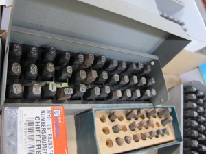 LOT TO INCLUDE STEEL STAMPS: (2) ALPHABETICAL SETS, 1/4", (1) ALPHABETICAL SET, 3/16", (2) NUMERICAL SETS, 1/8", (1) PARTIAL ALPHABETICAL SET-2115
