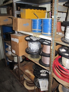 CONTENTS OF 8'X8'X20' STORAGE CONTAINER: "ELECTRICIANS DREAM II" LARGE QUANTITY OF: SPOOLS OF WIRE, COMMUNICATION CABLE, CLAMPS, SEALS, PLUGS, FITTINGS, LIGHTS, PLUS SO MUCH MORE. (G-20/#5) (TO BE PURCHASED ONLY BY AN INSURED BUYER, TO BE LOADED BY HAND. NO FORKLIFT USE ALLOWED.)-4408