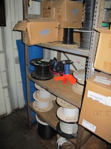 CONTENTS OF 8'X8'X20' STORAGE CONTAINER: "ELECTRICIANS DREAM II" LARGE QUANTITY OF: SPOOLS OF WIRE, COMMUNICATION CABLE, CLAMPS, SEALS, PLUGS, FITTINGS, LIGHTS, PLUS SO MUCH MORE. (G-20/#5) (TO BE PURCHASED ONLY BY AN INSURED BUYER, TO BE LOADED BY HAND. NO FORKLIFT USE ALLOWED.)-4408